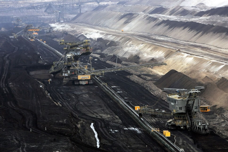 COTTBUS, GERMANY - MARCH 20:  Giant excavators extract lignite coal at the Jaenschwalde open-pit coal mine March 20, 2007 near Jaenschwalde, Germany. Though Germany has been among Europe's biggest proponents of CO2 emissions reductions, it remains heavily dependant on coal for its energy needs. The mine is run by the Swedish energy suppllier Vattenfall.  (Photo by Sean Gallup/Getty Images)